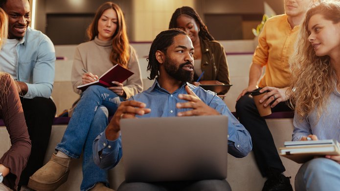 a group of people studying with their instructor