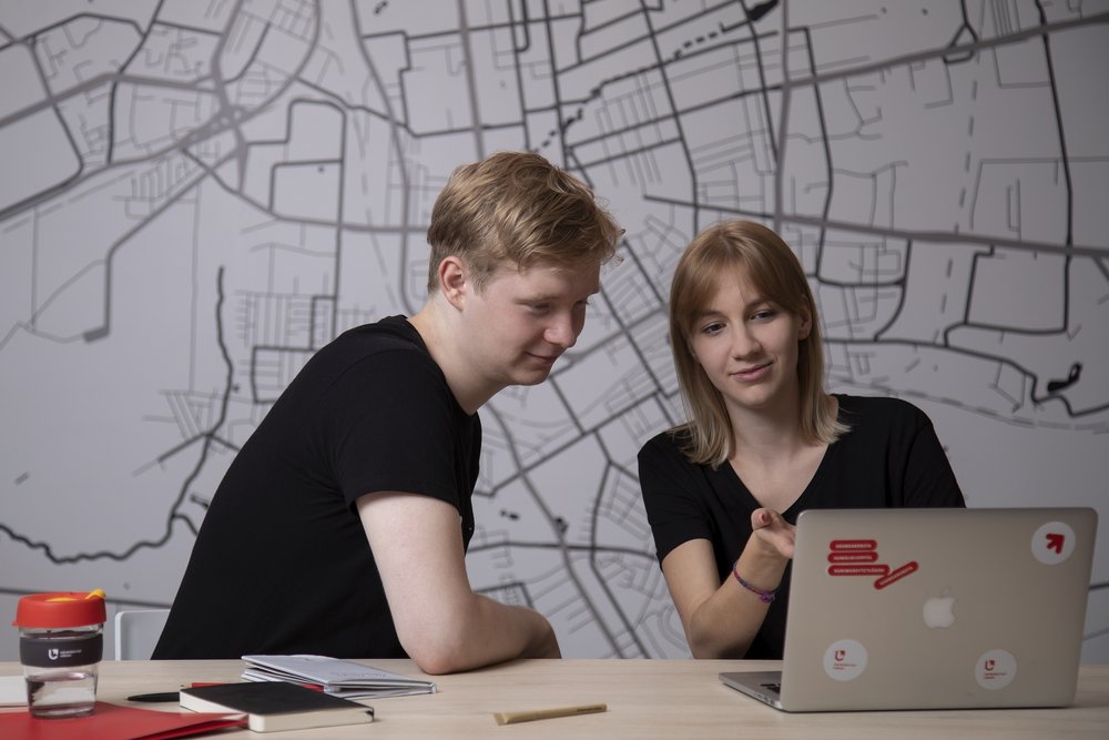 Two University of Lodz students sitting at a computer
