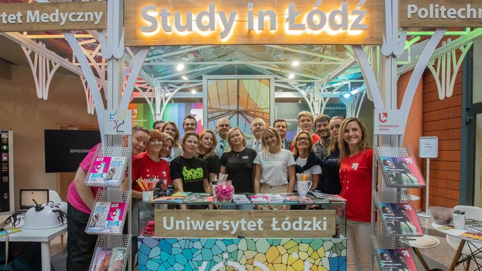a group photo next to the joint stand Study in Lodz