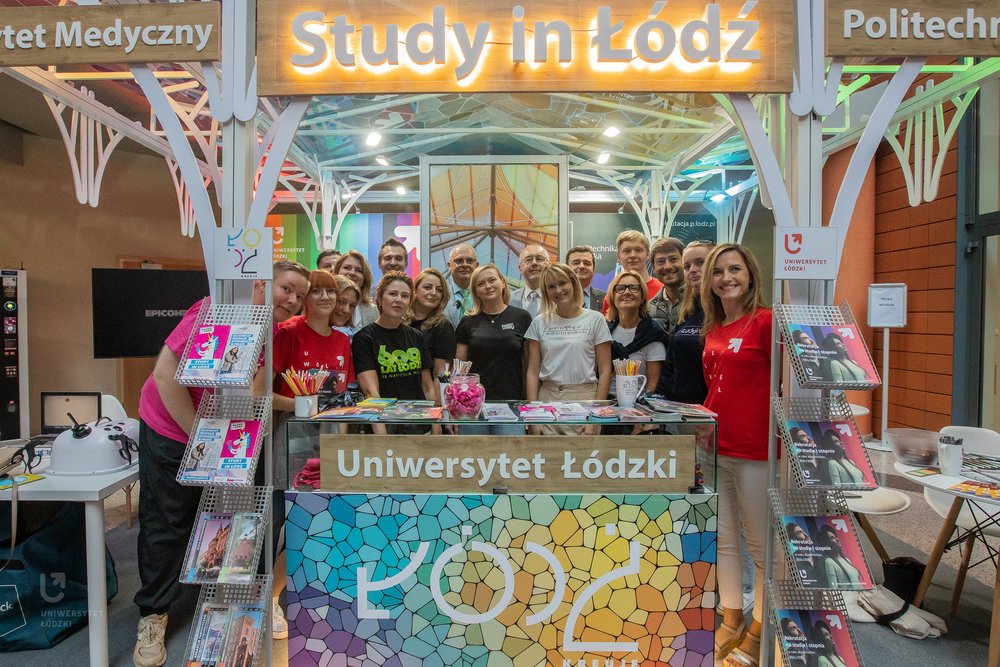 a group photo next to the joint stand Study in Lodz