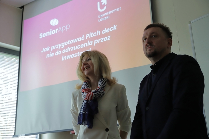 Presenter in front of the presentation